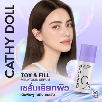 Cathy Doll Tox & Fill Melatonin Serum advertisement featuring a woman with long dark hair, clear facial skin and a purple serum bottle on a pastel iridescent background with Thai text.