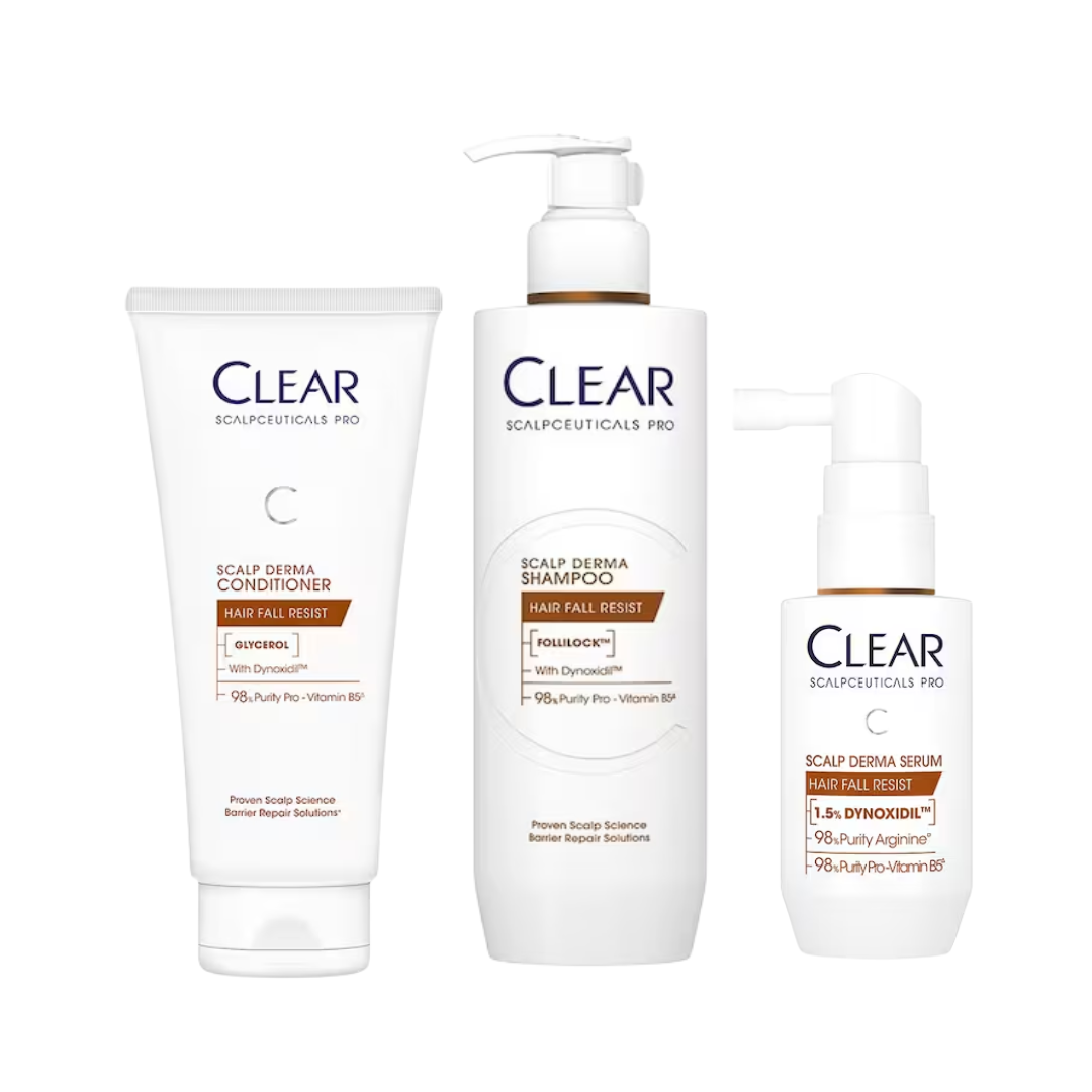 Three white hair care products from Clear Scalpceuticals Pro on a white background: a tube of scalp derma conditioner, a pump bottle of scalp derma shampoo, and a pump bottle of scalp derma serum.