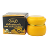 Yellow cream jar with gold lid and black box labeled 'SKY' on a white background