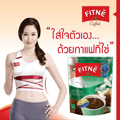 A jar of FITNE' Coffee mix with a white and red label, containing L-lysine to support metabolism and energy production